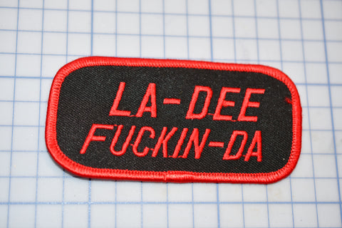 a patch with the words la - dee fucking - da printed on it