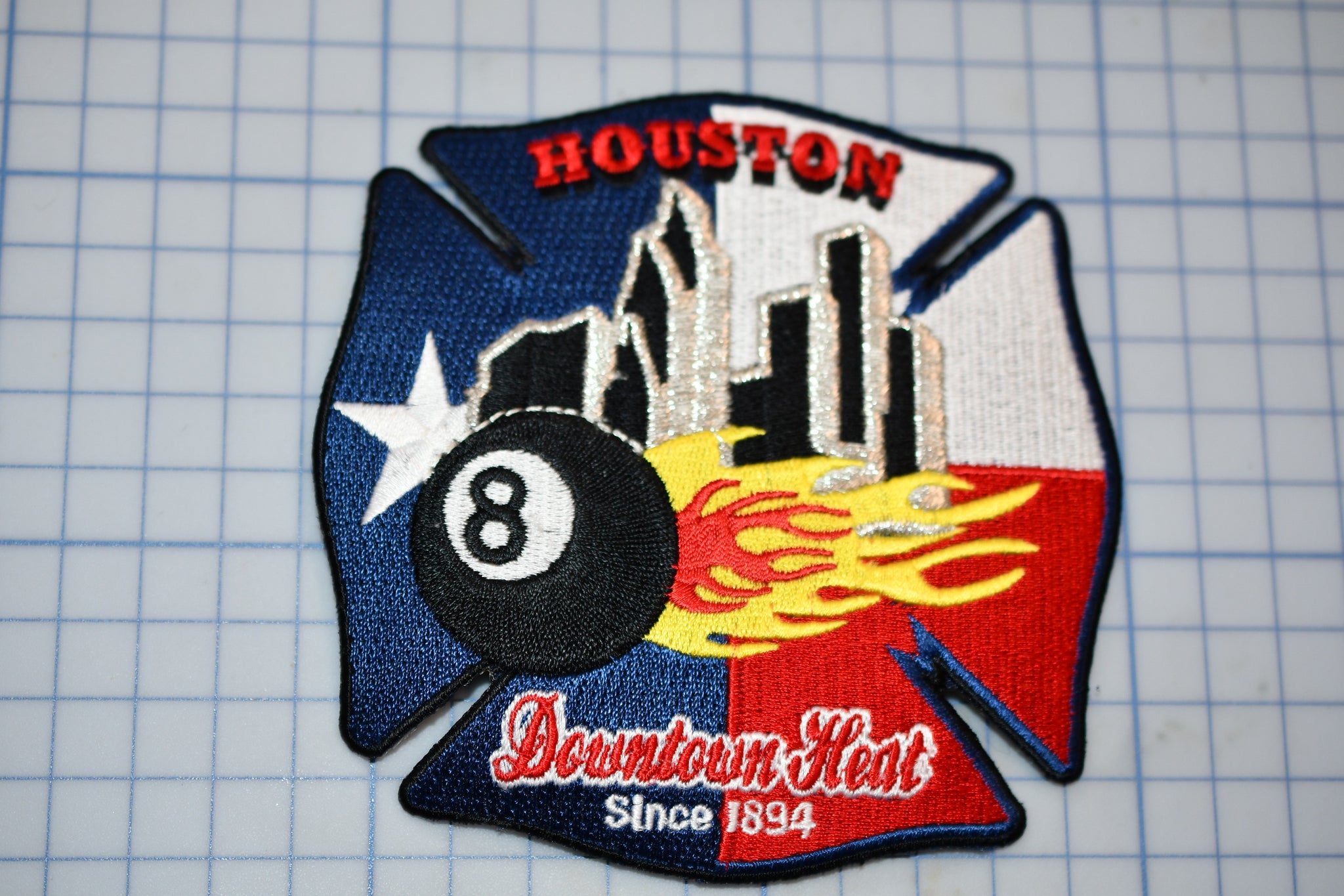 a patch with a picture of a billiard eight ball