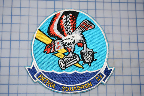 a patch with a picture of an eagle on a surfboard