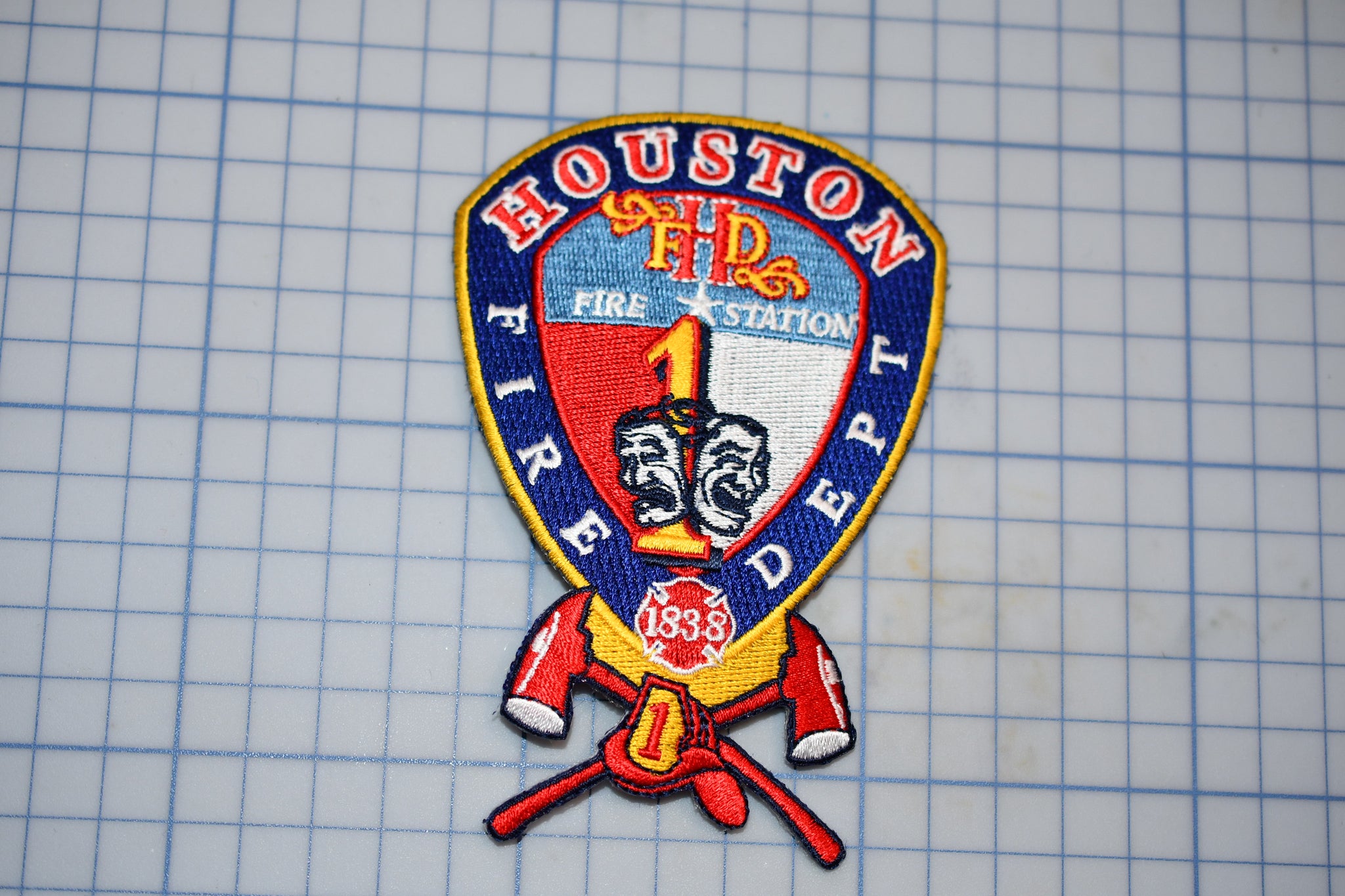 a houston fire department patch on a piece of paper