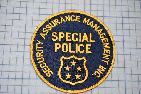 a police patch with the words security assurance management on it