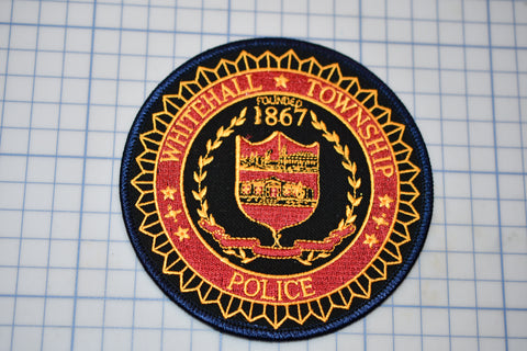 a patch with a picture of a police badge on it