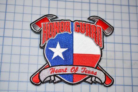a patch with a flag and two crossed axes