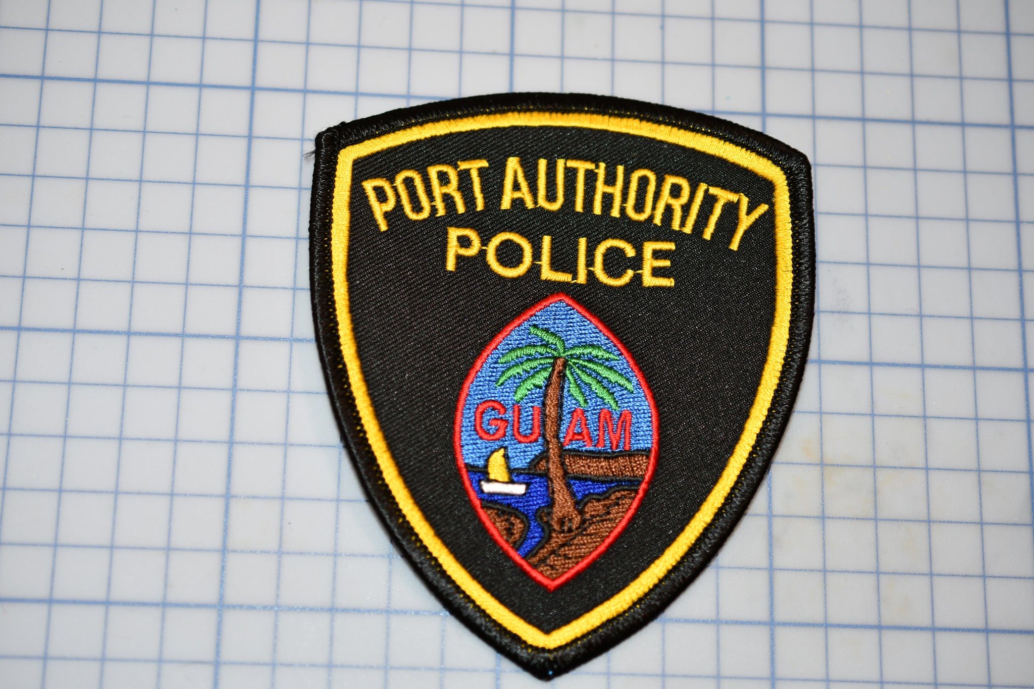 a port authority police patch sitting on top of a table