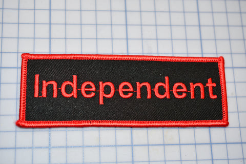 a red and black patch with the word independent on it