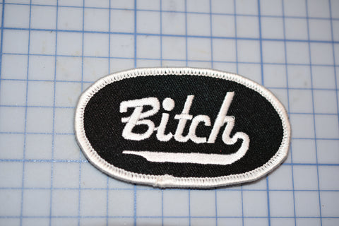 a patch with the word bitch on it