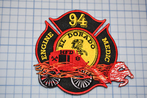 a patch with a fire truck on it